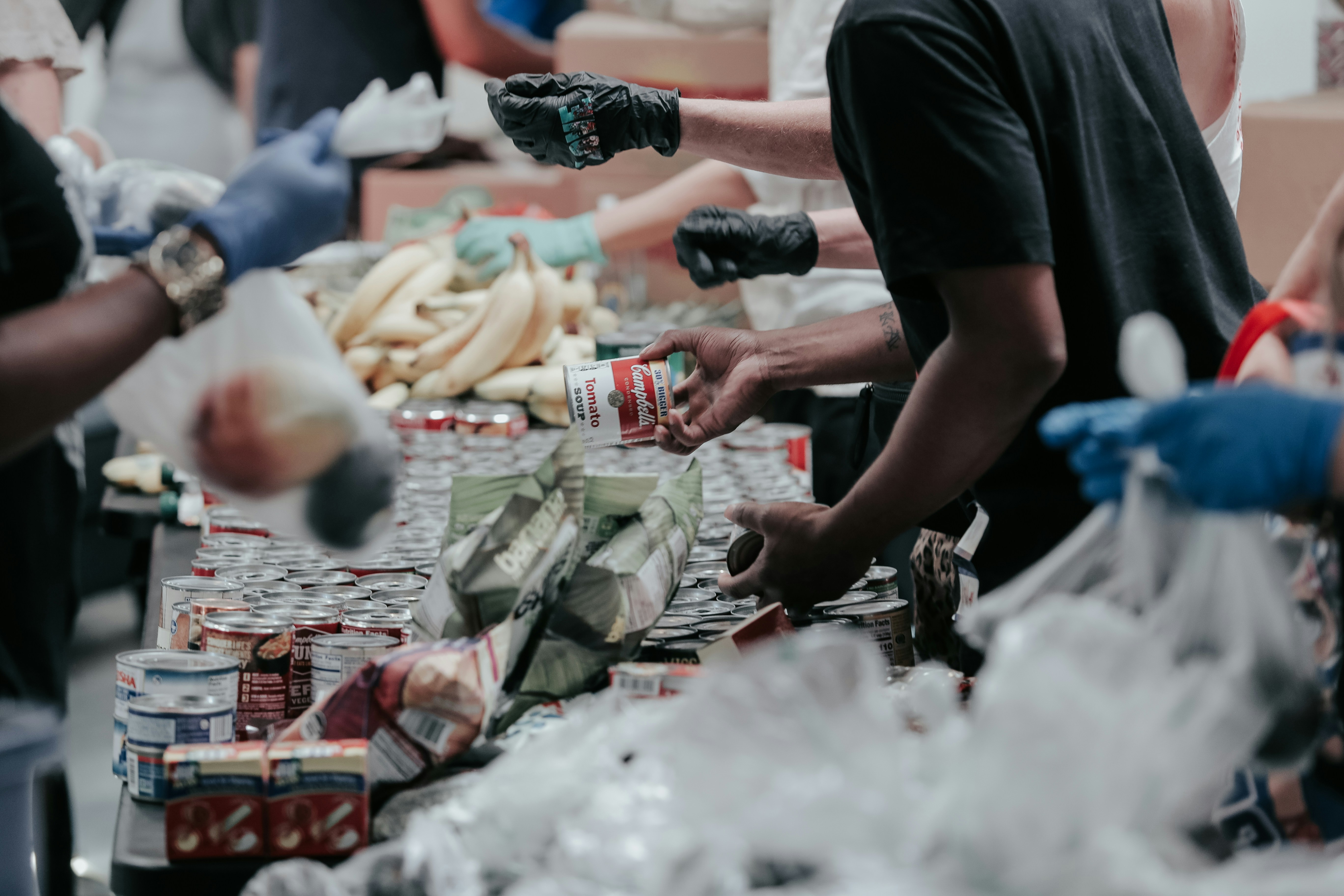 Volunteers in a food sorting warehouse